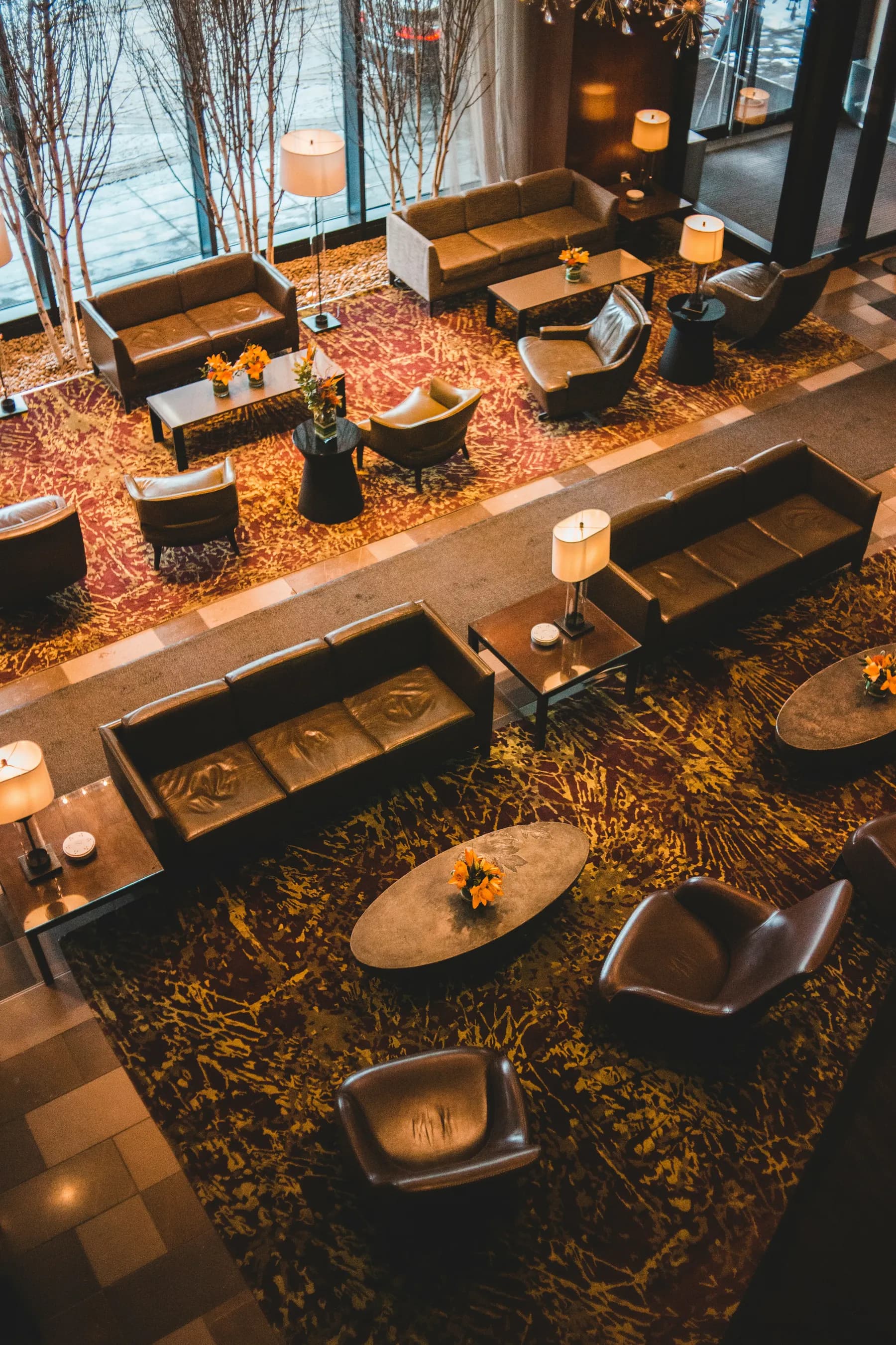 Hotel lounge with seating and warm interior lighting
